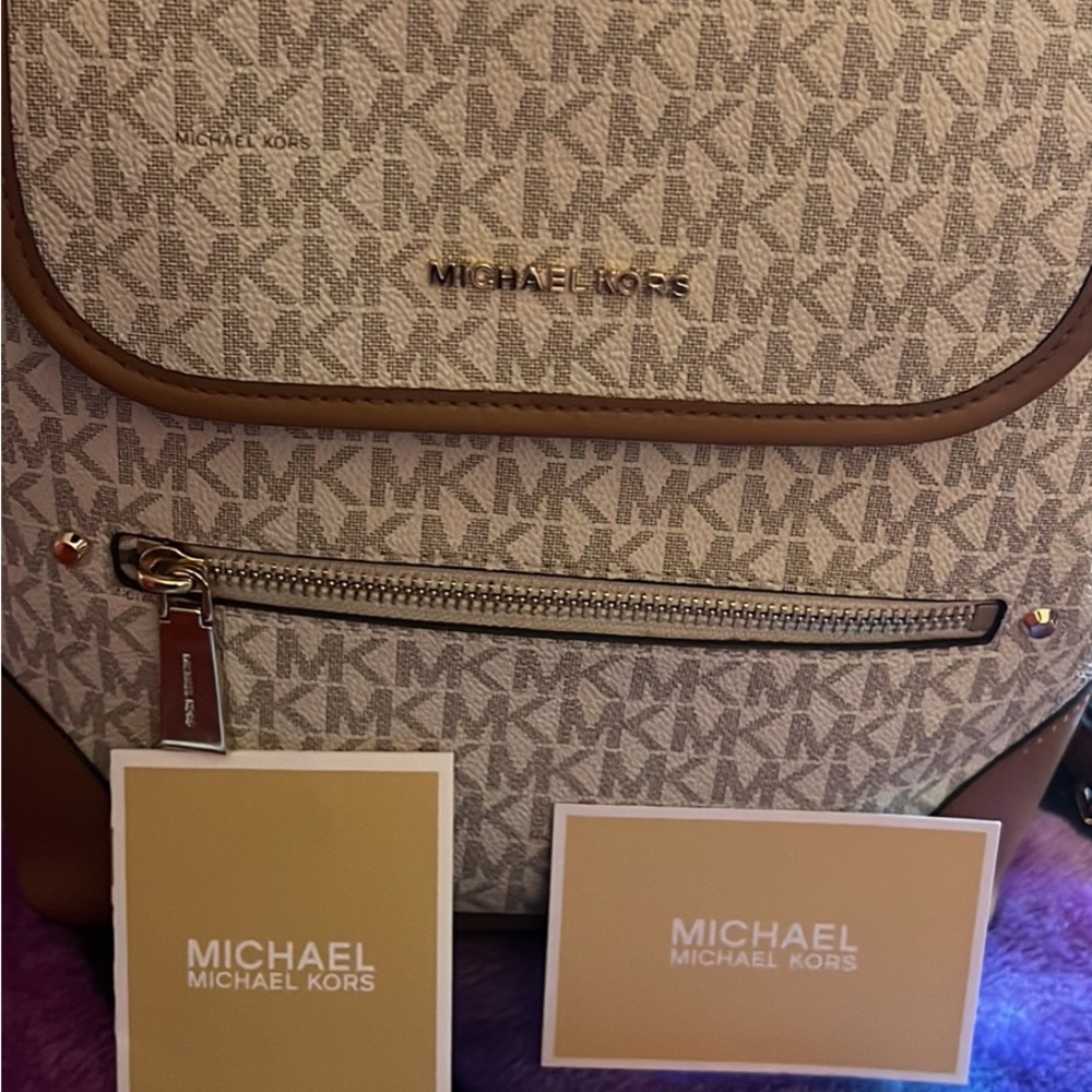 New Michael Kors backpack and matching wallet.